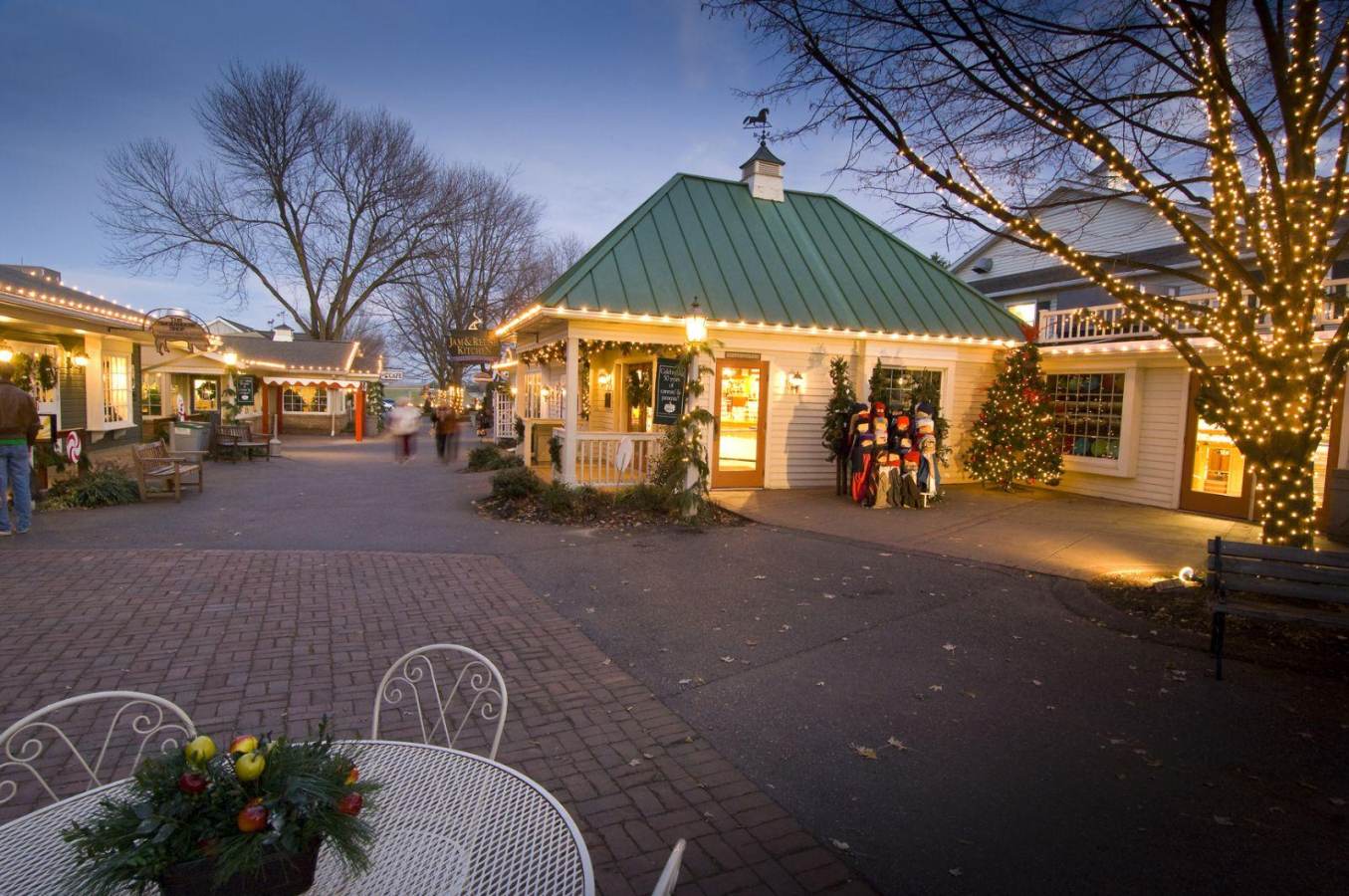 An evening exterior at Kitchen Kettle Village, adorned with holiday lights in Lancaster, PA Credit: DiscoverLancaster.com